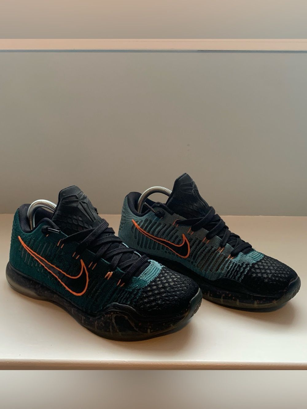 Nike Kobe 10 Elite Low "Drill Sergeant" sneakers, featuring a teal Flyknit upper